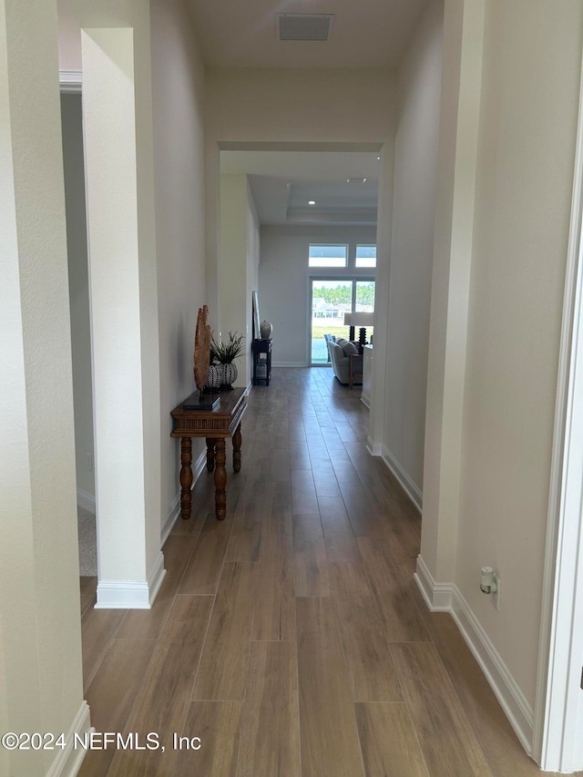 hallway featuring hardwood / wood-style floors