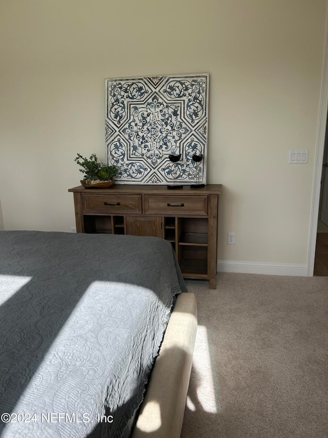 bedroom featuring carpet