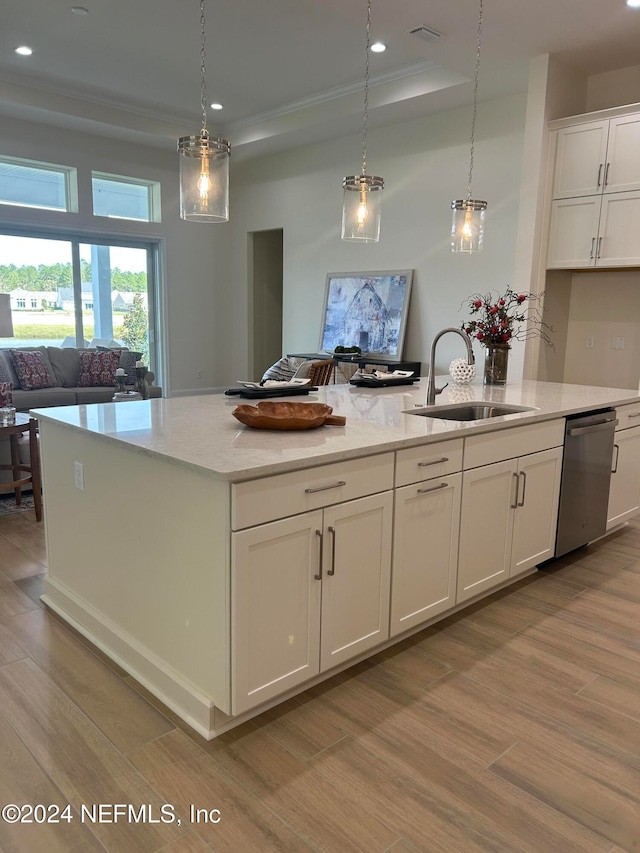 kitchen with dishwasher, white cabinets, light hardwood / wood-style flooring, and sink