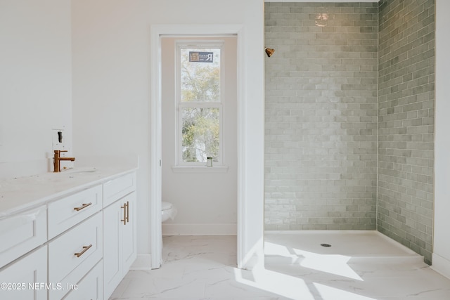 full bathroom featuring baseboards, toilet, marble finish floor, vanity, and a shower stall