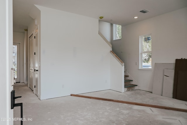 staircase featuring visible vents