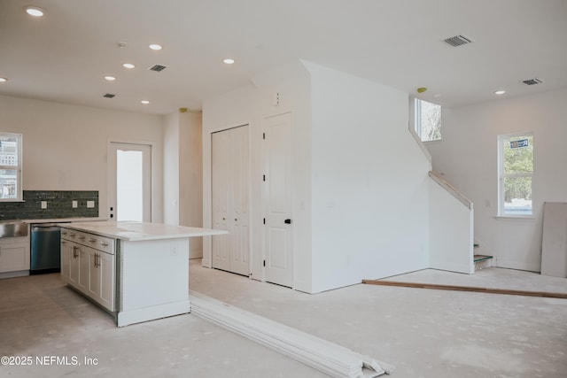 kitchen with recessed lighting, visible vents, backsplash, and stainless steel dishwasher