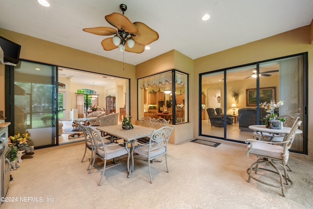 dining room with ceiling fan and carpet floors