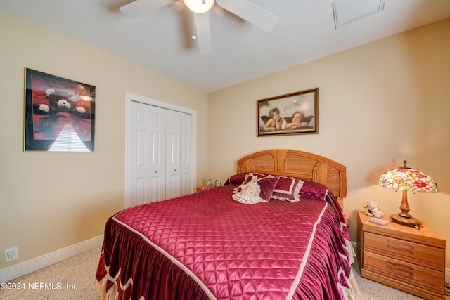 carpeted bedroom with a closet and ceiling fan