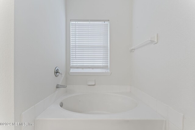 bathroom with a washtub