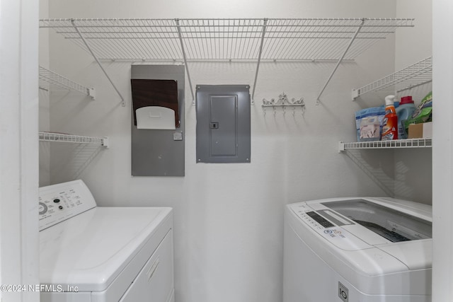 laundry area featuring electric panel and washer and dryer