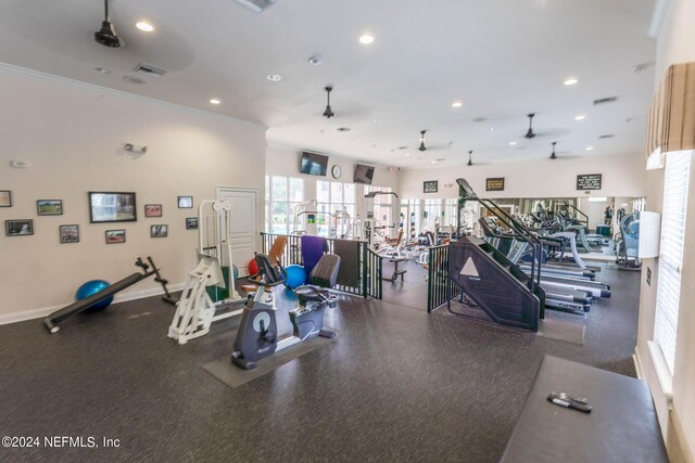 gym featuring crown molding, baseboards, visible vents, and recessed lighting