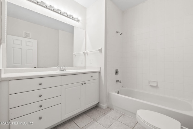 full bath featuring bathing tub / shower combination, tile patterned floors, vanity, and toilet