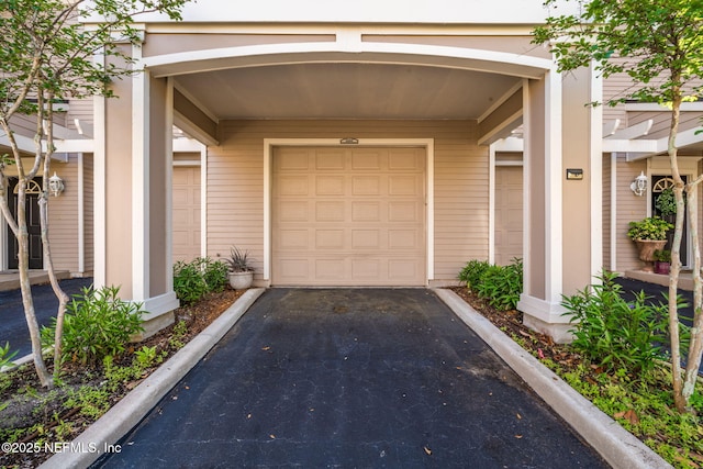 garage featuring aphalt driveway