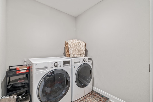 washroom with independent washer and dryer