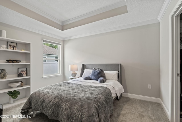 bedroom with carpet, crown molding, and a textured ceiling