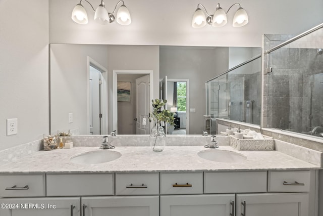 bathroom with vanity and an enclosed shower