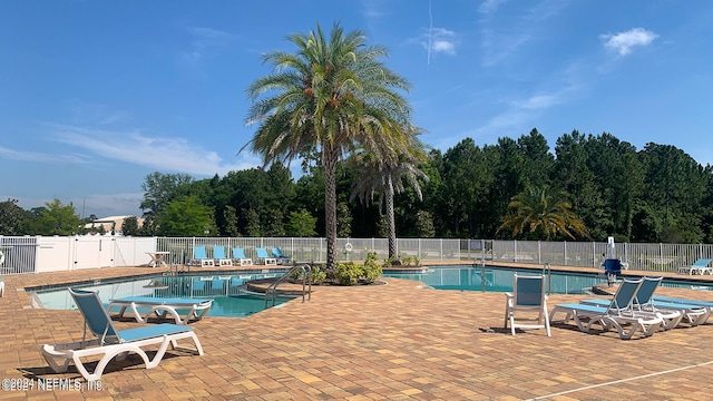 view of swimming pool featuring a patio area