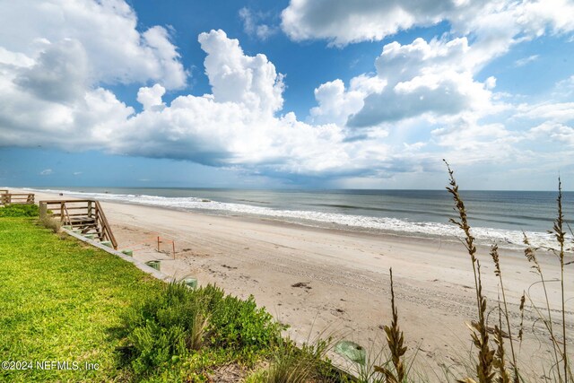 view of water feature with a beach view