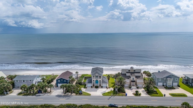 birds eye view of property featuring a residential view, a view of the beach, and a water view