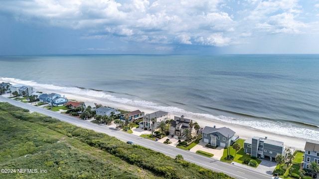 bird's eye view with a water view and a view of the beach