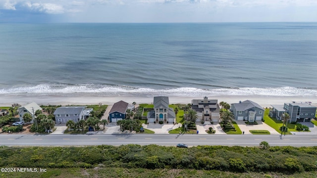 bird's eye view featuring a residential view, a beach view, and a water view