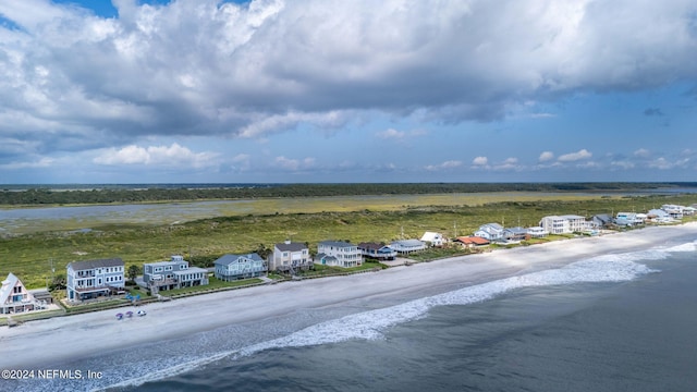 bird's eye view featuring a beach view and a water view