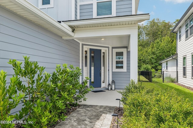 property entrance with a yard