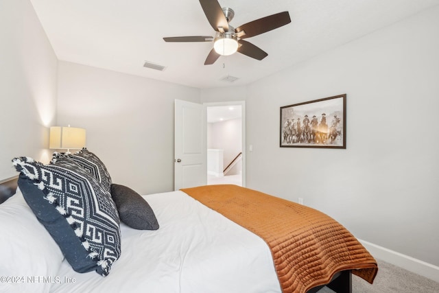 carpeted bedroom featuring ceiling fan