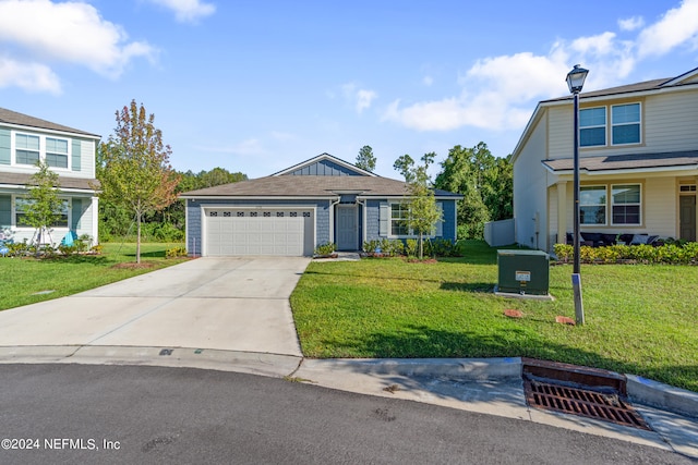 view of front facade featuring a front lawn, board and batten siding, concrete driveway, and an attached garage