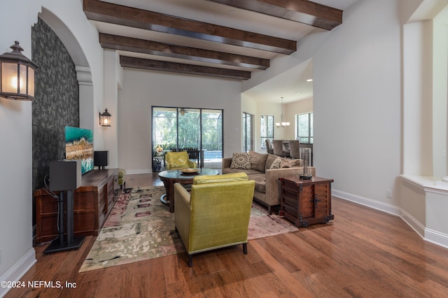 living room with hardwood / wood-style floors and beam ceiling