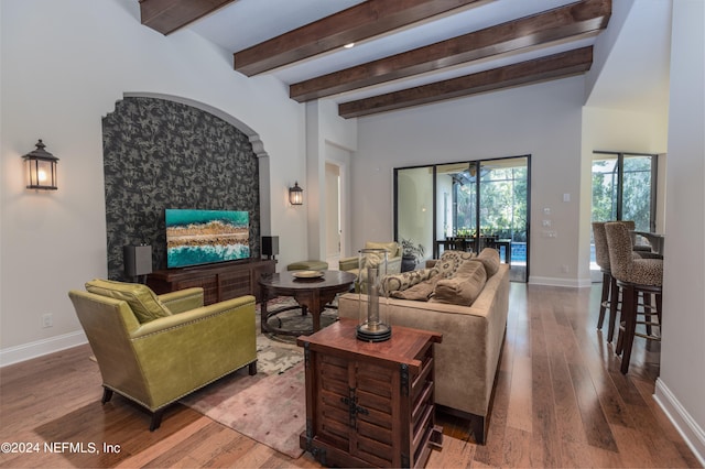 living room with hardwood / wood-style floors and beam ceiling