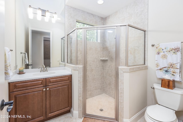 bathroom featuring tile patterned floors, walk in shower, toilet, and vanity