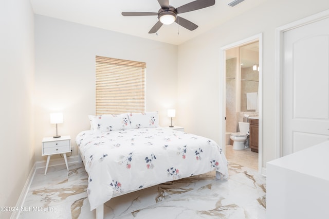 bedroom with ensuite bath and ceiling fan