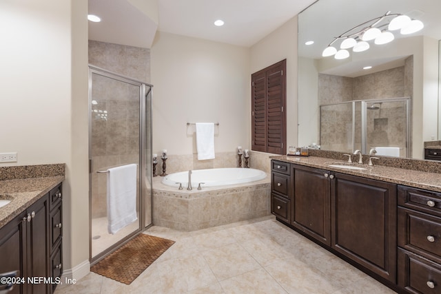 bathroom with vanity, plus walk in shower, and tile patterned floors