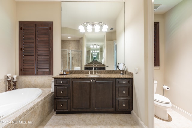 full bathroom with tile patterned floors, separate shower and tub, toilet, and vanity