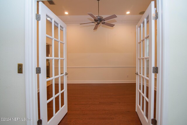 hall featuring baseboards, wood finished floors, crown molding, french doors, and recessed lighting