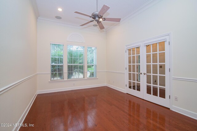 unfurnished room featuring ornamental molding, french doors, baseboards, and wood finished floors