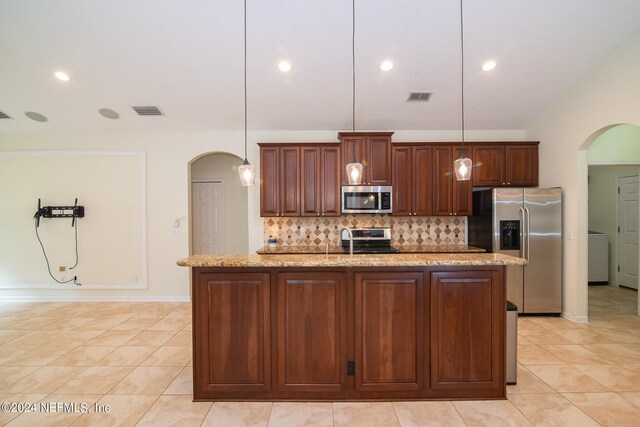 kitchen featuring visible vents, arched walkways, and stainless steel appliances