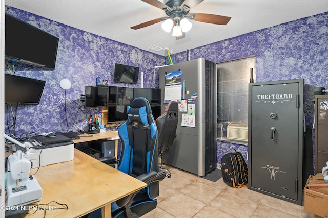 tiled office with ceiling fan and a textured ceiling