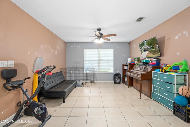 interior space featuring ceiling fan and light tile patterned floors