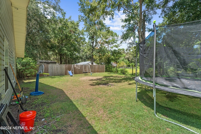 view of yard featuring a trampoline