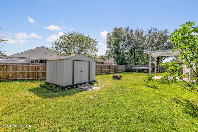 view of yard with a storage unit