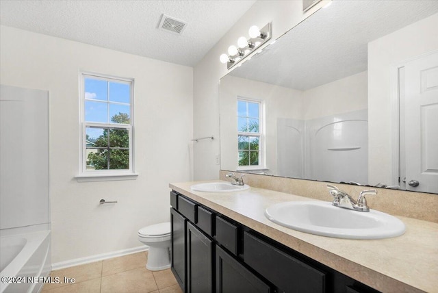 bathroom with toilet, a sink, visible vents, and tile patterned floors