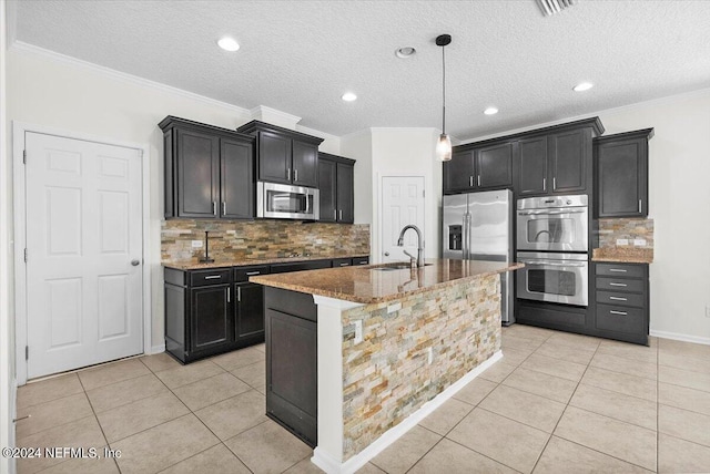 kitchen with light stone counters, light tile patterned floors, stainless steel appliances, ornamental molding, and a sink