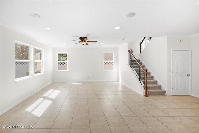 empty room featuring light tile patterned floors, recessed lighting, baseboards, ornamental molding, and stairway