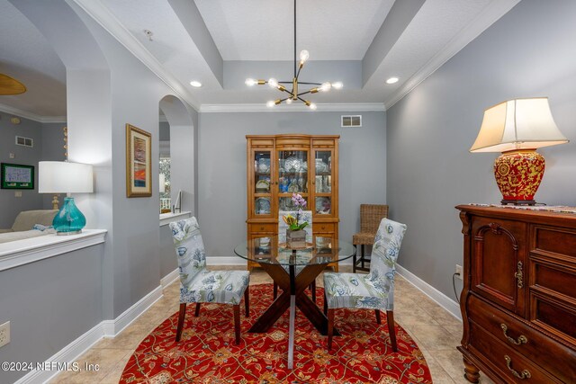 sitting room featuring ornamental molding, a notable chandelier, and light tile patterned floors