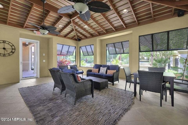 tiled living room featuring wood ceiling, beam ceiling, ceiling fan, and high vaulted ceiling