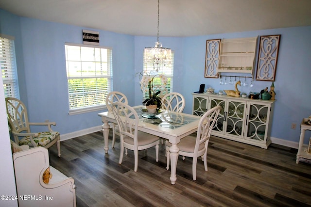 dining room featuring a chandelier and dark hardwood / wood-style flooring