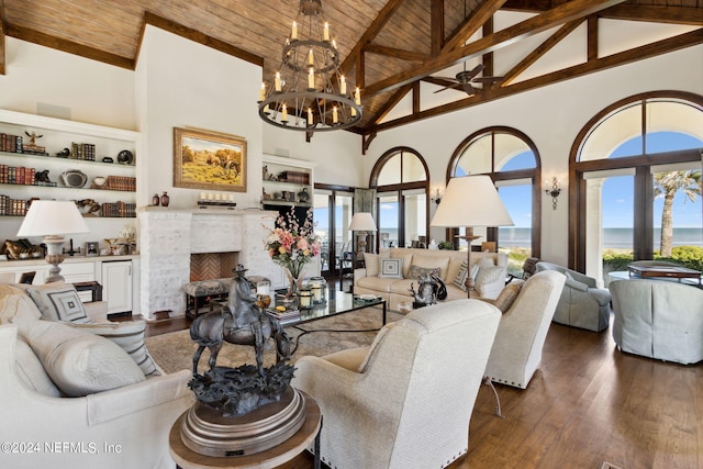 901 Ponte Vedra Blvd, Ponte Vedra Beach, FL 32082 - living room featuring wood ceiling, ceiling fan with notable chandelier, a premium fireplace, beam ceiling, and high vaulted ceiling