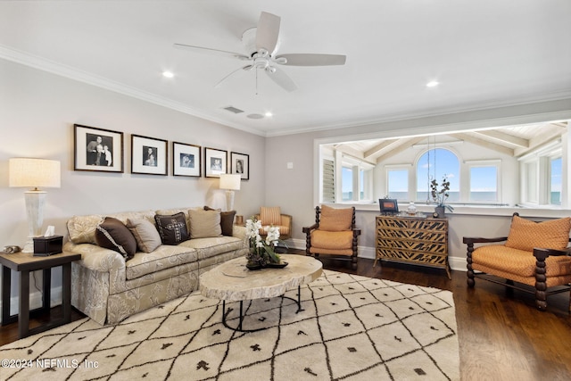 living room featuring light wood-type flooring, beamed ceiling, ornamental molding, and ceiling fan