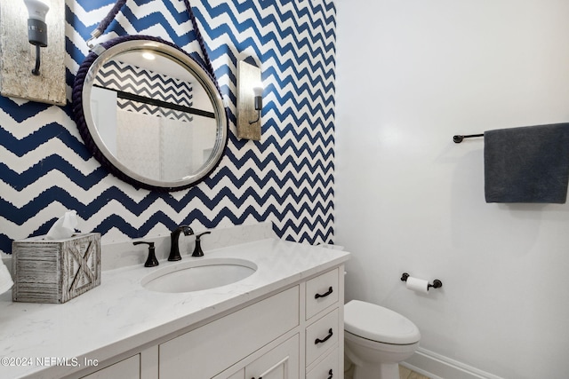 bathroom with vanity and toilet