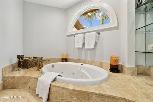 bathroom with a relaxing tiled tub