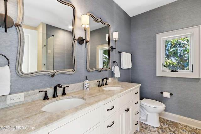 901 Ponte Vedra Blvd, Ponte Vedra Beach, FL 32082 - bathroom featuring double vanity, toilet, tiled shower, and a sink