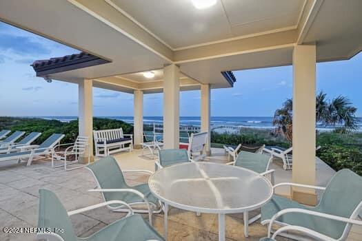 view of patio featuring a water view